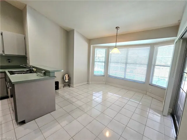 Family dining area with sliders to your pool area