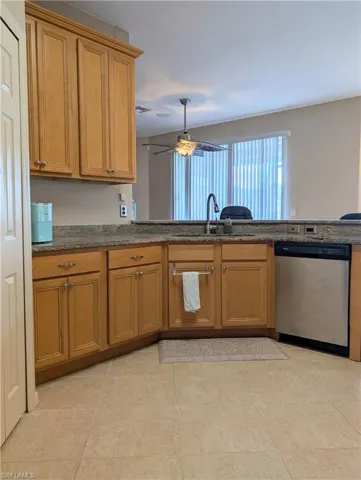 Kitchen stainless steel appliances and walk in pantry.