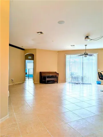 Tiled with ceiling fan.