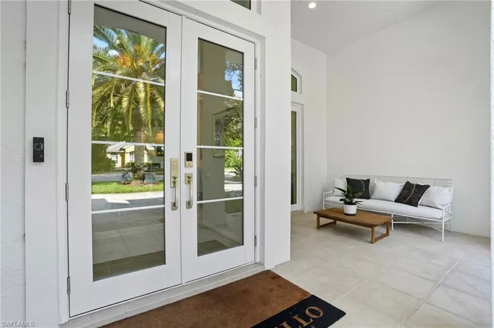 Entryway featuring french doors and tile patterned floors