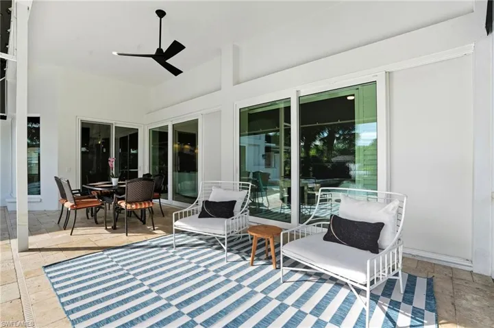 View of patio featuring ceiling fan and outdoor dining area