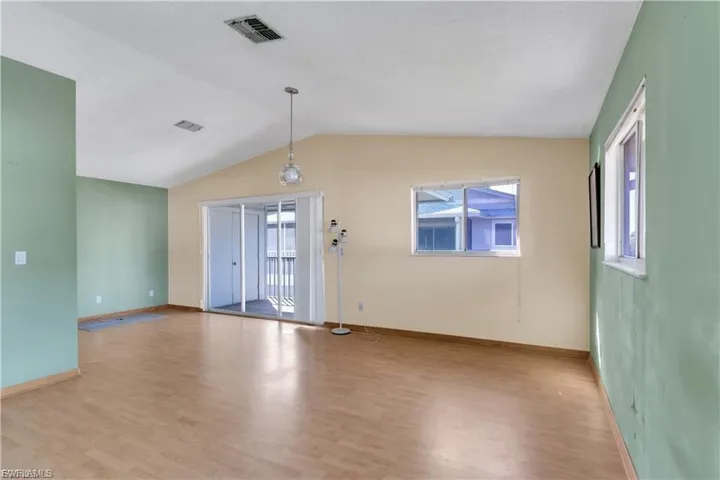 Unfurnished room featuring light wood-style floors and baseboards