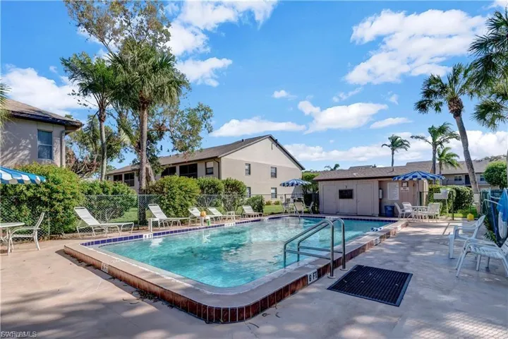 Community pool with a patio area