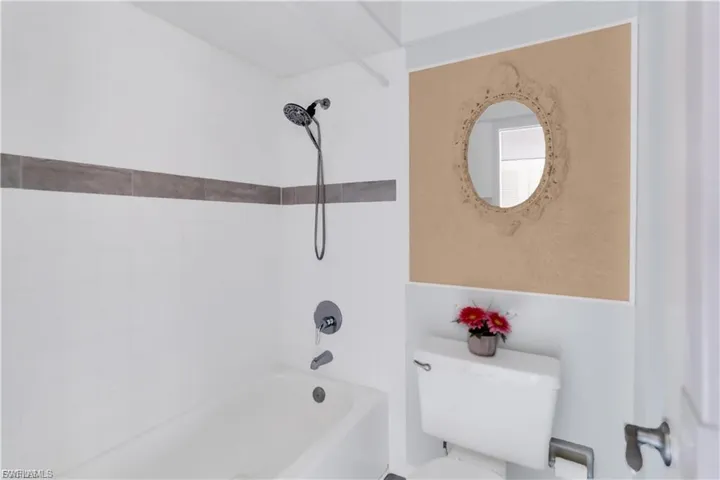 Full bathroom featuring toilet and shower / bathtub combination
