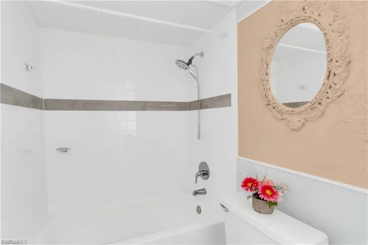 Full bathroom featuring toilet and  shower combination
