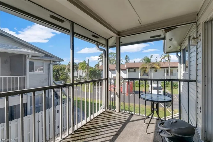 Balcony with a sunroom and grilling area