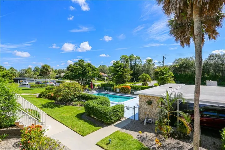 View of swimming pool with a yard