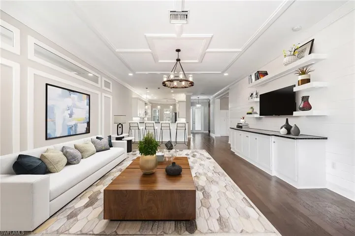 Spacious, open great room with custom built-in and accents (virtually staged)