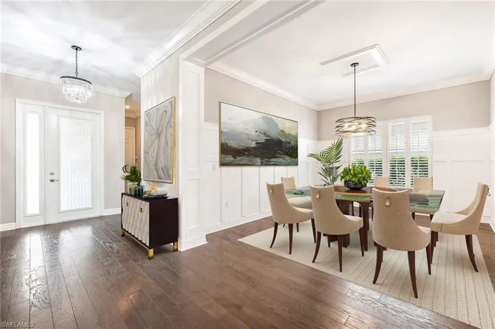 Large foyer and dining room (virutally staged)