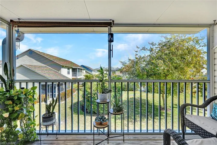 Balcony featuring a sunroom