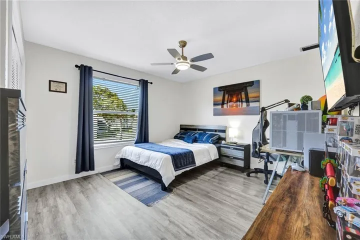 Bedroom featuring light wood finished floors and a ceiling fan