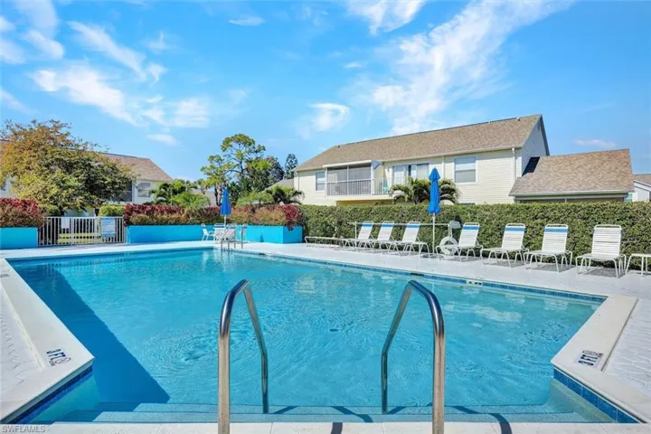 Community pool featuring a patio