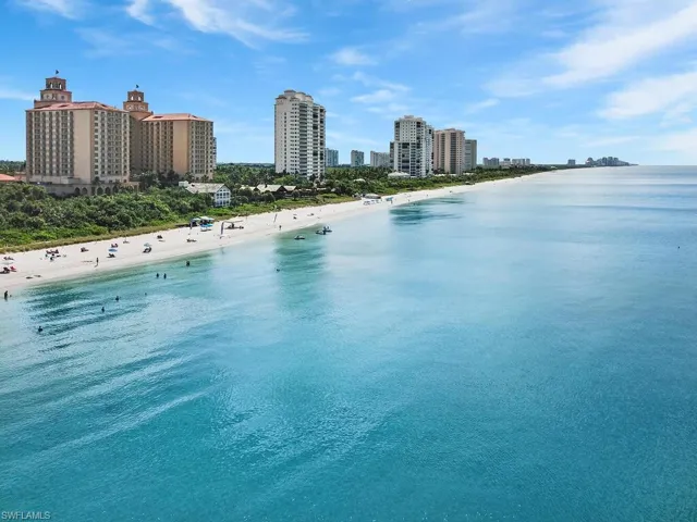 Water view with city skyline and local beach