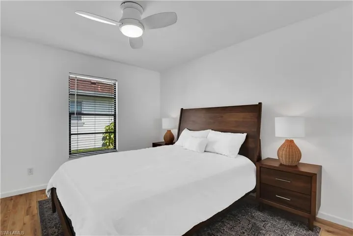 Bedroom with light wood-style floors and ceiling fan