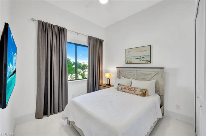 Bedroom with a closet and ceiling fan