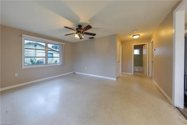 Unfurnished room featuring ceiling fan