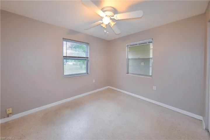 Unfurnished room featuring ceiling fan