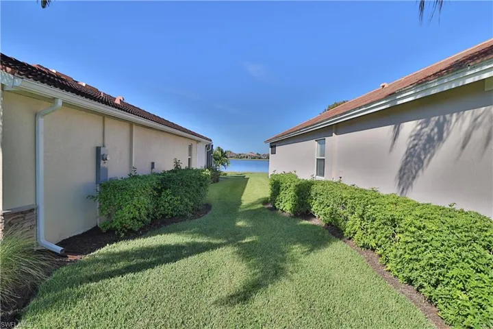 View of yard with a water view