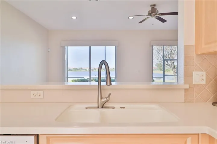 Kitchen featuring tasteful backsplash, light brown cabinetry, sink, and plenty of natural light