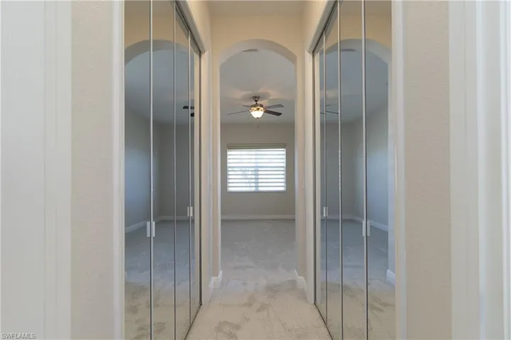 Hallway with light carpet