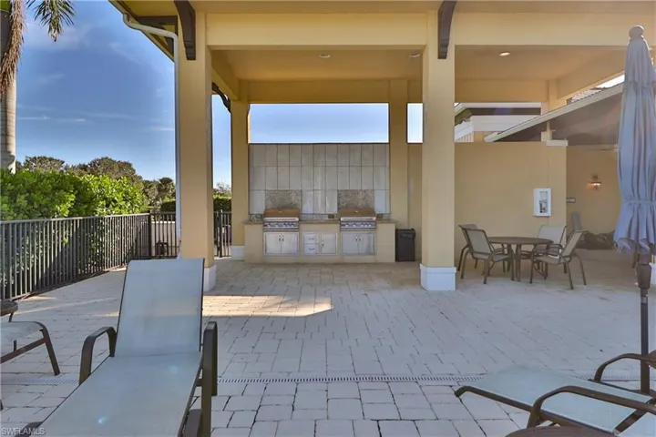 View of patio with a grill and area for grilling