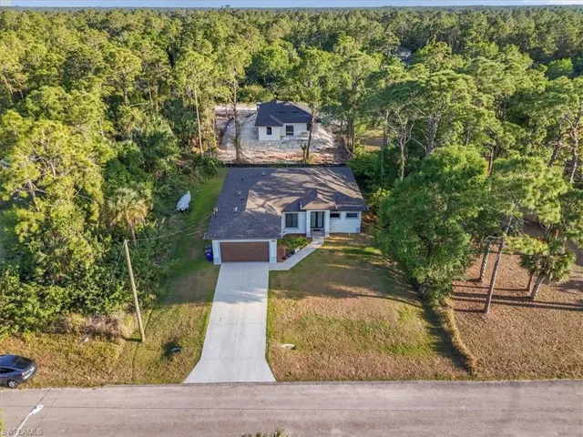 Bird's eye view with a wooded view