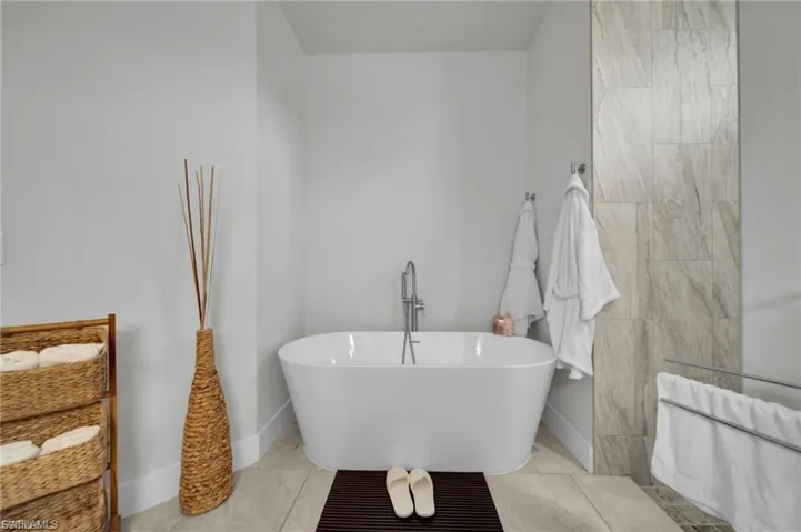 Full bath with a freestanding bath and vanity
