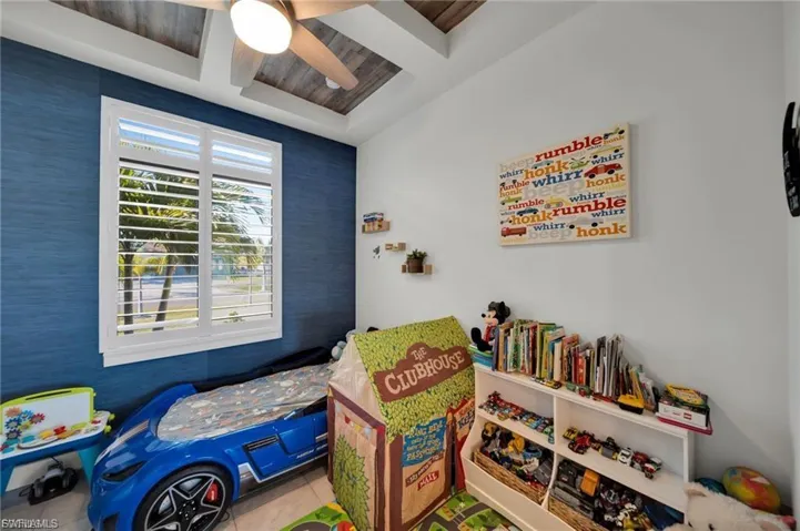 Playroom with wood ceiling, ceiling fan, and coffered ceiling