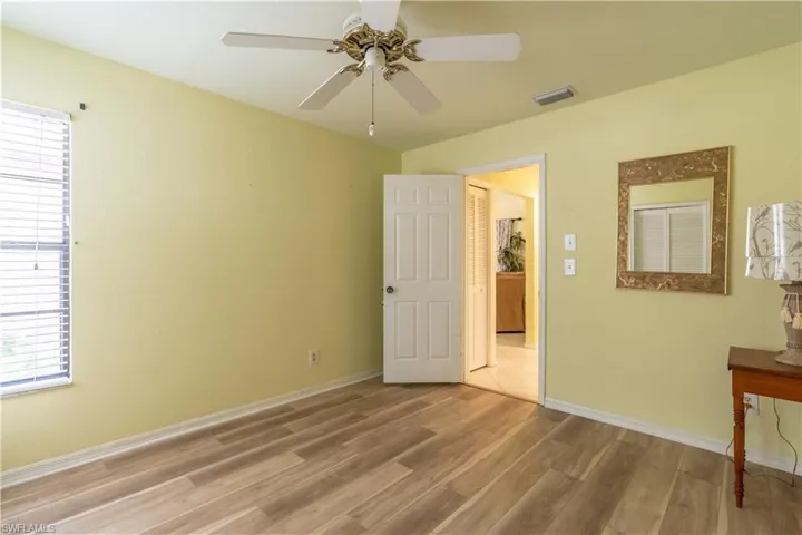 Unfurnished bedroom with light wood-type flooring and ceiling fan