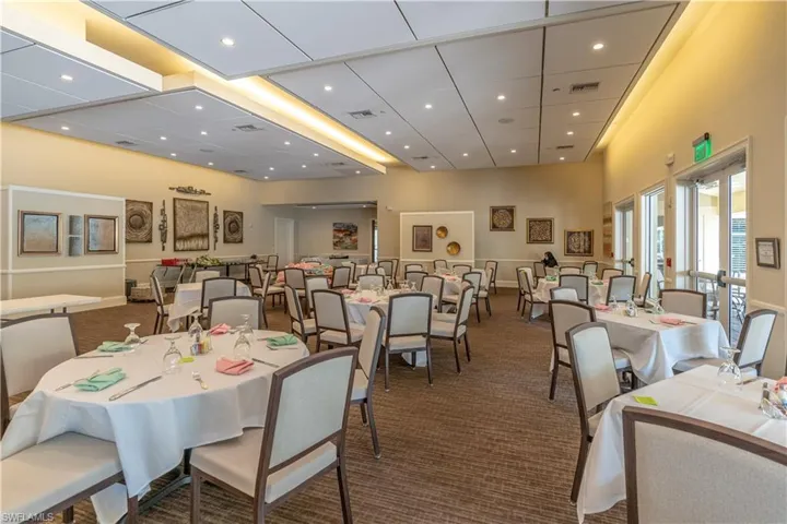 Dining room featuring a high ceiling and carpet floors