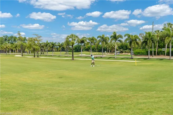 View of property's community featuring a yard