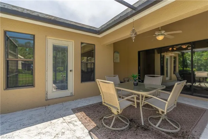 View of patio featuring ceiling fan