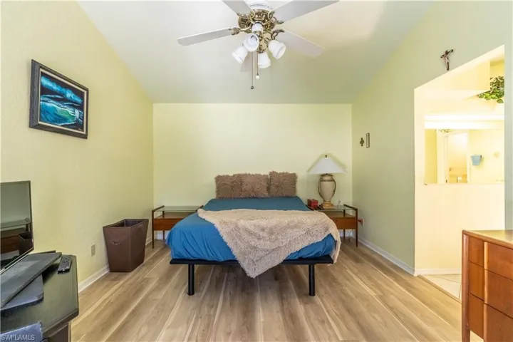 Bedroom featuring ceiling fan and light hardwood / wood-style flooring