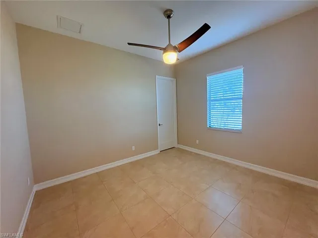 BEDROOM # 3 - UNFURNISHED.  AFTER THE UPGRADES.  THIS TILE IS THE SAME THROUGHOUT THE HOME.