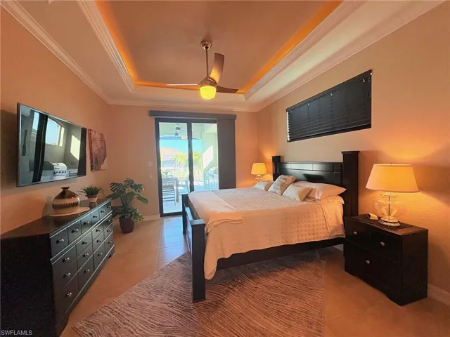LARGE MASTER SUITE WITH LIGHTED TRAY CEILING WITH CROWN & ACCESS TO THE POOL