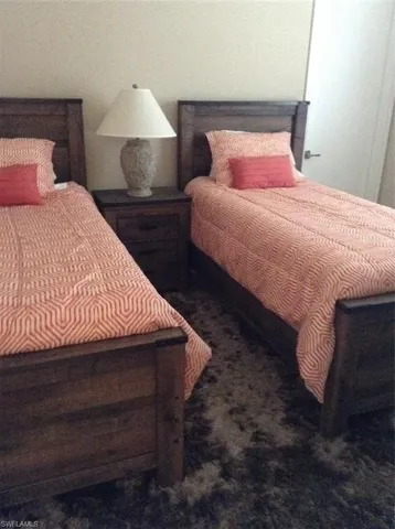 BEDROOM # 3 SHOWN FURNISHED BEFORE THE UPGRADES WERE MADE. THE FLOORING WAS UPGRADED WITH THE SAME TILE AS THE REST OF THE HOME.