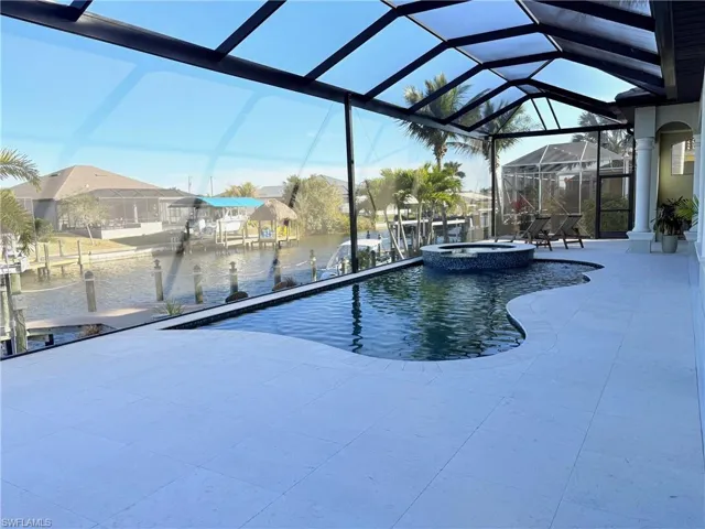 VERY LARGE POOL DECK WITH SHELL STONE TILE EZ TO CLEAN AND STAYS COOL