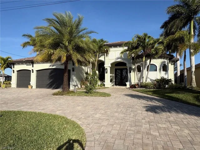 WITH HUGE PAVERED, CIRCULAR DRIVEWAY
