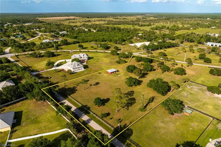 Birds eye view of property featuring a rural view