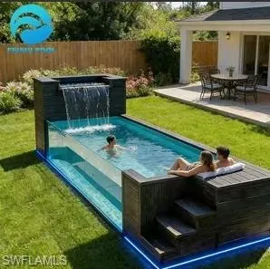 Contemporary above-ground pool with a glass side panel, integrated waterfall feature, and an attached wood-finish deck with steps
