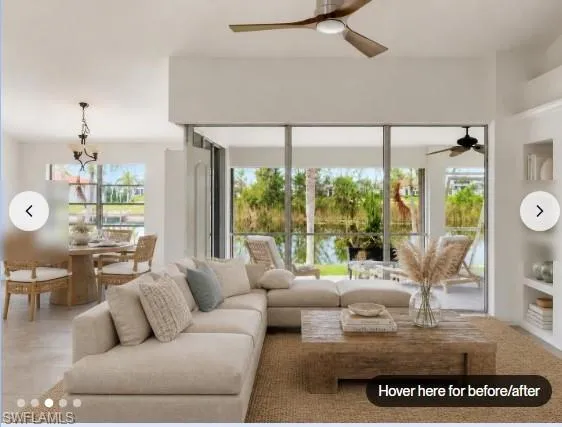 Staged pic - living area with recessed lighting, an expansive glass sliding door, and built-in shelving