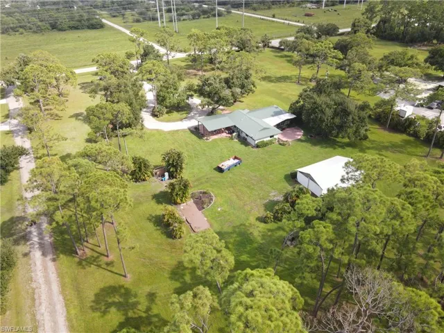 View of property location with a tree filled landscape
