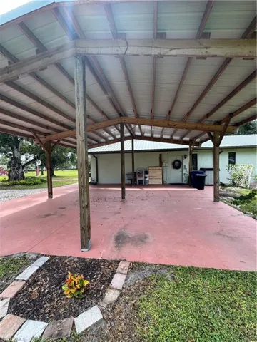 Carport with high ceilings.