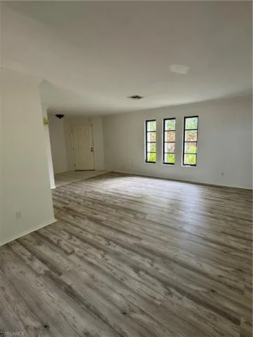 dining area looking into LR and front door.