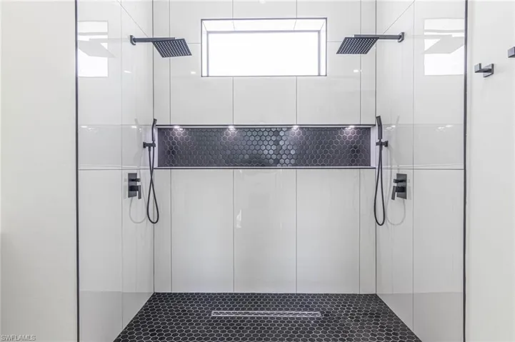 Full bath with a tile shower