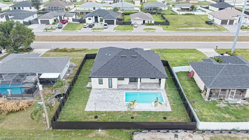 Aerial view of residential area with a pool