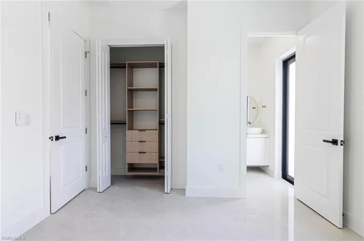 Unfurnished bedroom featuring baseboards and a closet