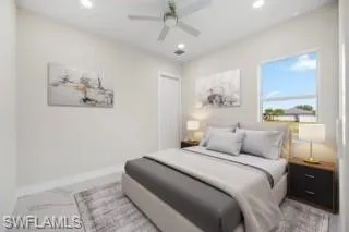 Tiled bedroom with ceiling fan and a closet