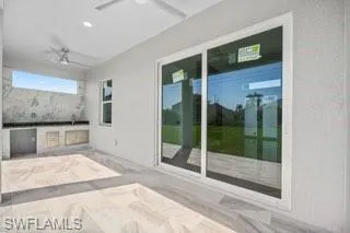 View of patio / terrace featuring ceiling fan
