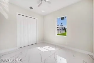 Unfurnished bedroom with a closet and ceiling fan